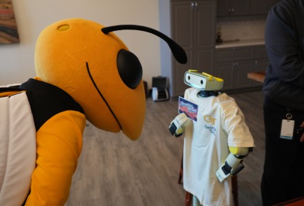 Buzz, the Georgia Tech mascot, meets a Sprout robot.