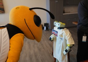 Buzz, the Georgia Tech mascot, meets a Sprout robot.