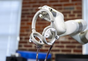Spherephones headset with a robotic arm